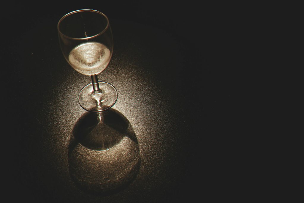 wine glass sitting on the ground