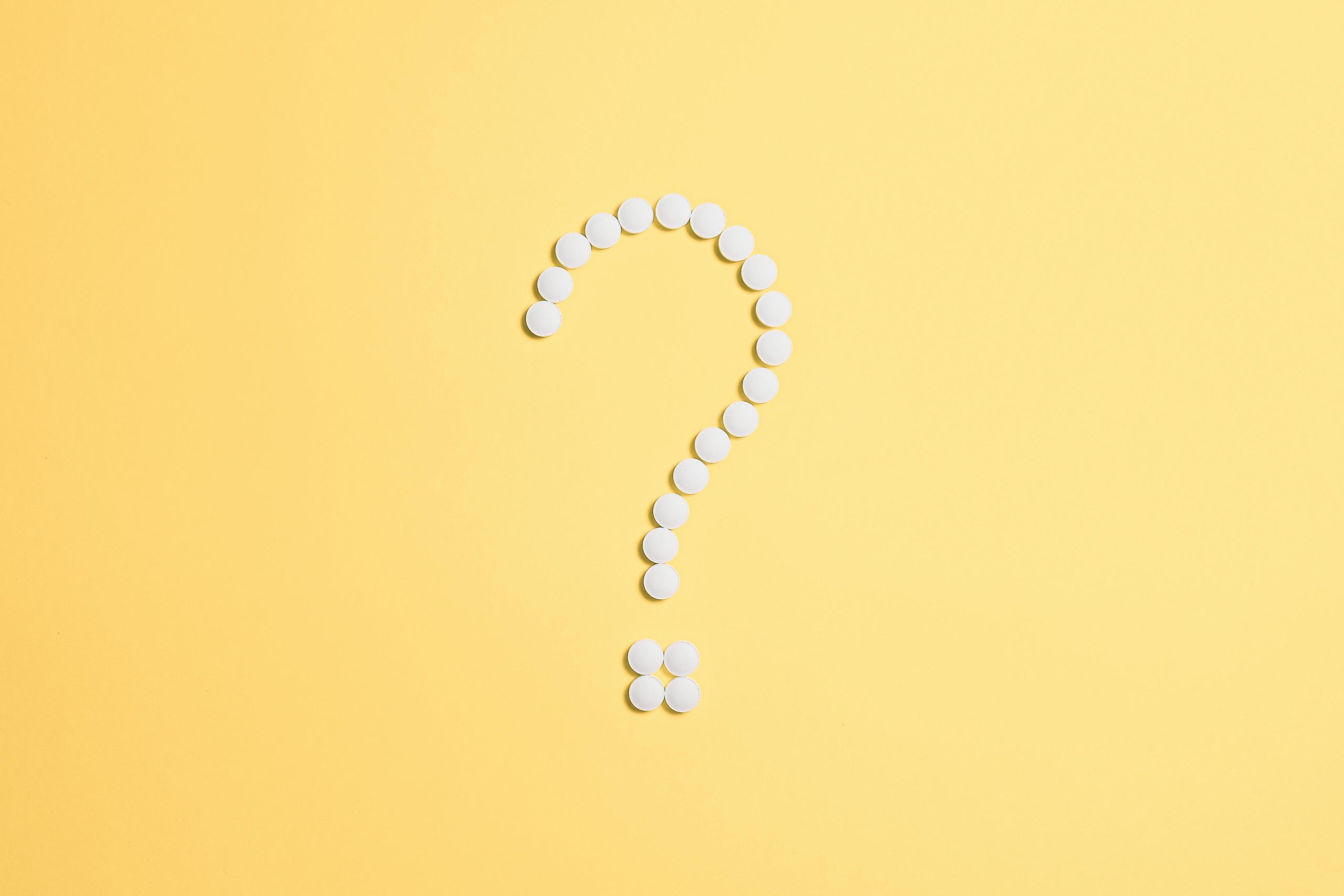 Question mark made of pills