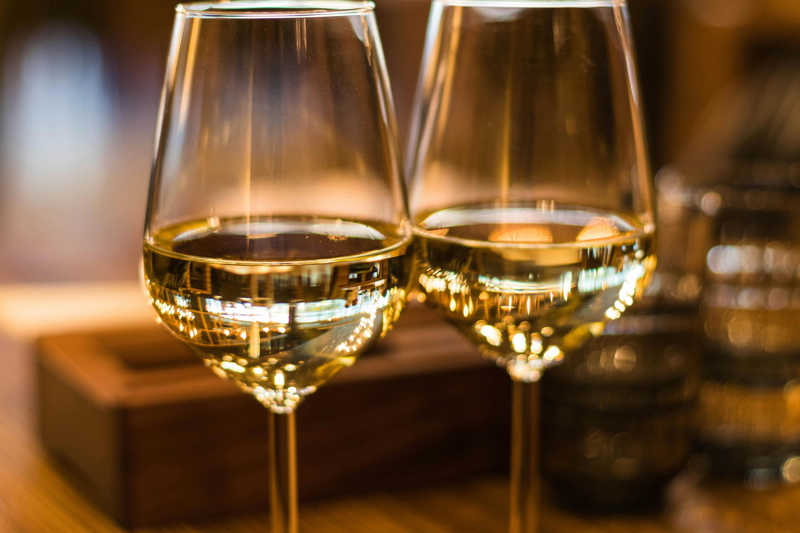 Two glasses of wine sitting next to each other