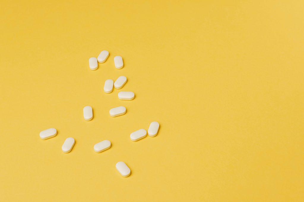 Pills on a yellow background